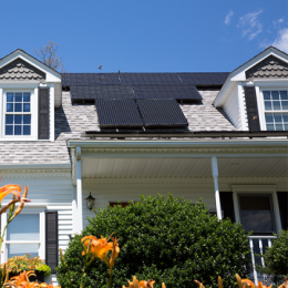 Roof of a home with black solar panels on it